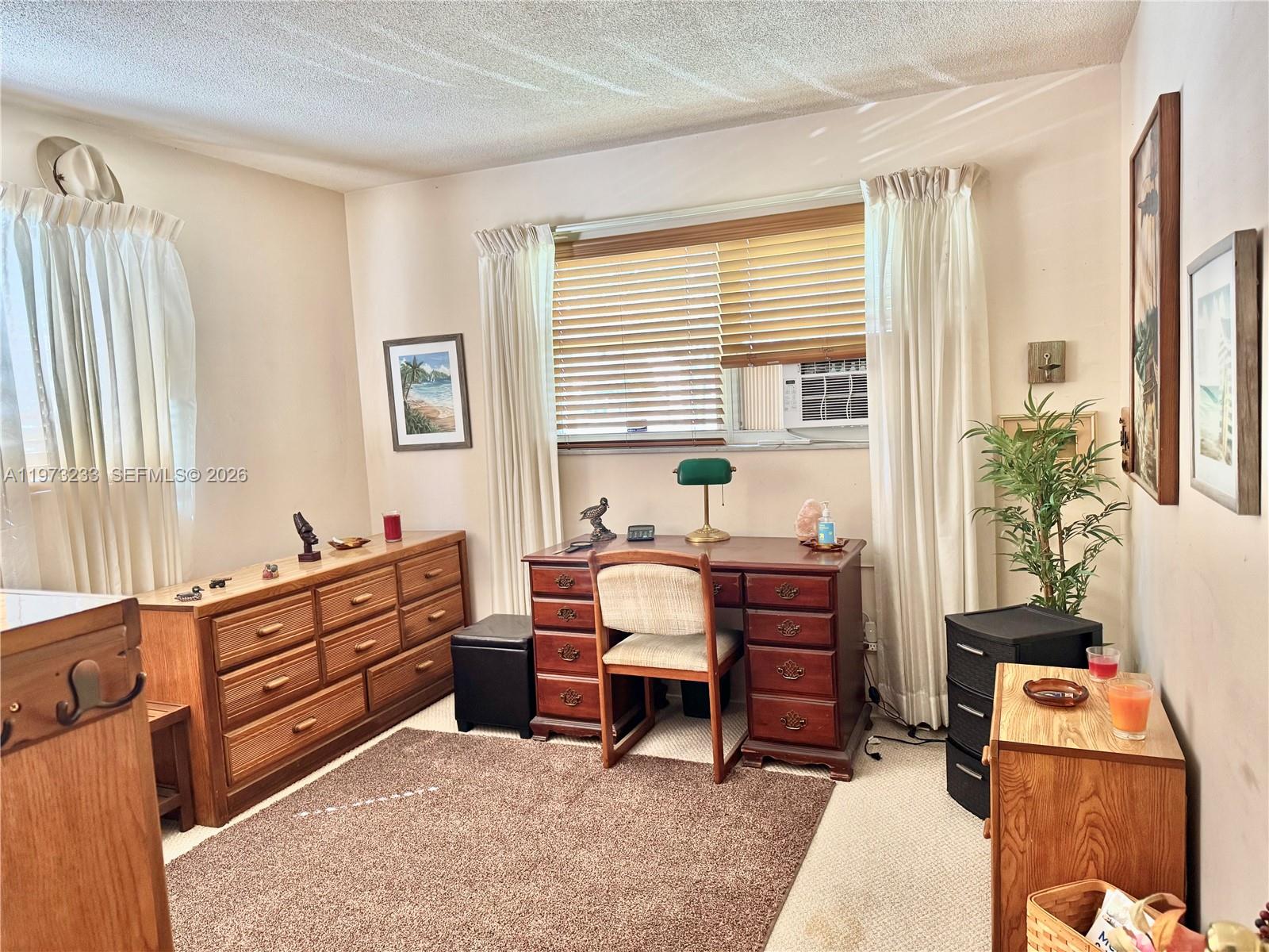 3500 Harrison Street, Unit 7 Hollywood, FL 33021 - Photo 65 of 66 a bedroom with furniture and a window