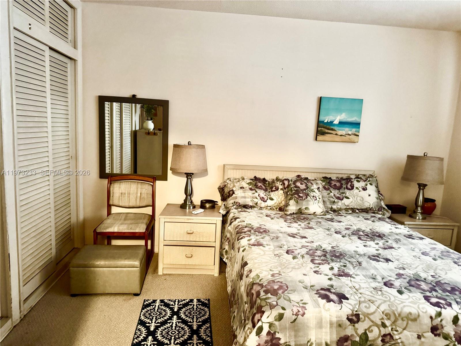 3500 Harrison Street, Unit 7 Hollywood, FL 33021 - Photo 7 of 66 a bedroom with a bed and wooden floor