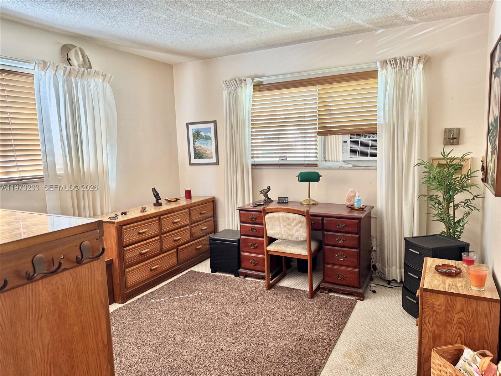 3500 Harrison Street, Unit 7 Hollywood, FL 33021 - Photo 8 of 66 a room with furniture window and a table