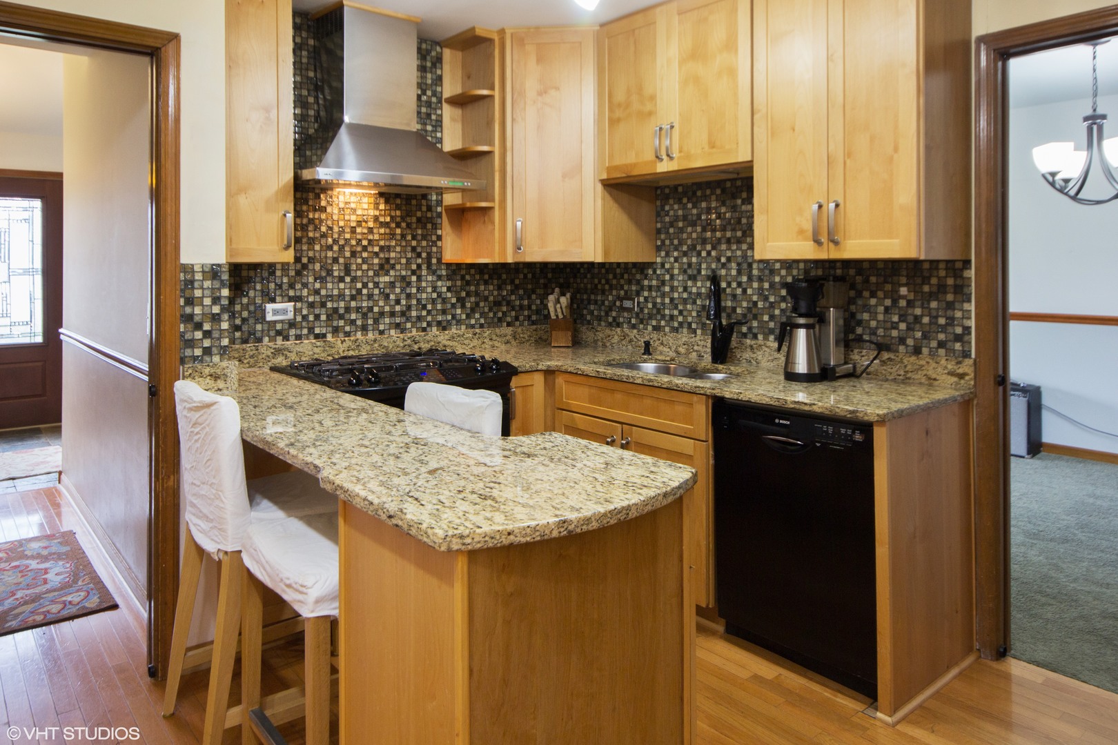 414 South Raven Road Shorewood, IL 60404 - Photo 5 of 15 a kitchen with stainless steel appliances granite countertop a sink and cabinets