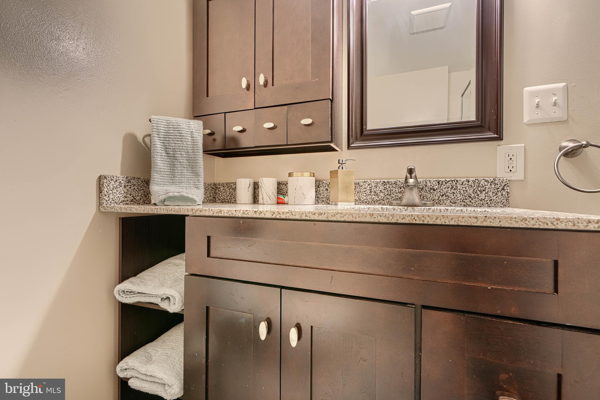 2110 Folkstone Road Lutherville-Timonium, MD 21093 - Photo 33 of 49 a bathroom with a sink and a mirror