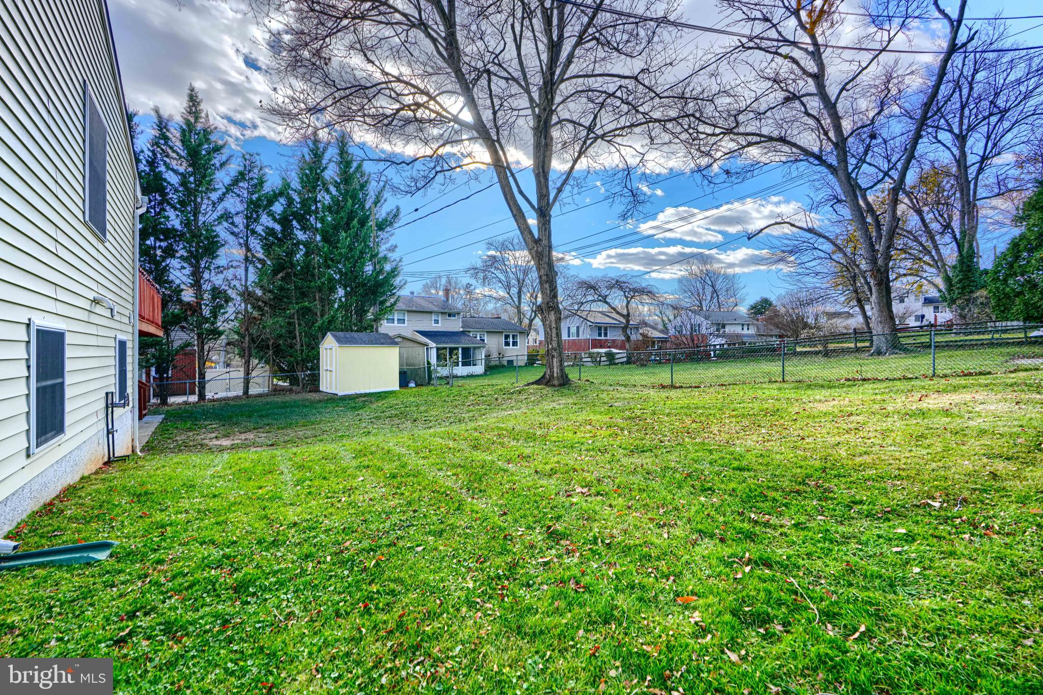 2110 Folkstone Road Lutherville-Timonium, MD 21093 - Photo 46 of 49 a backyard of a house with lots of green space