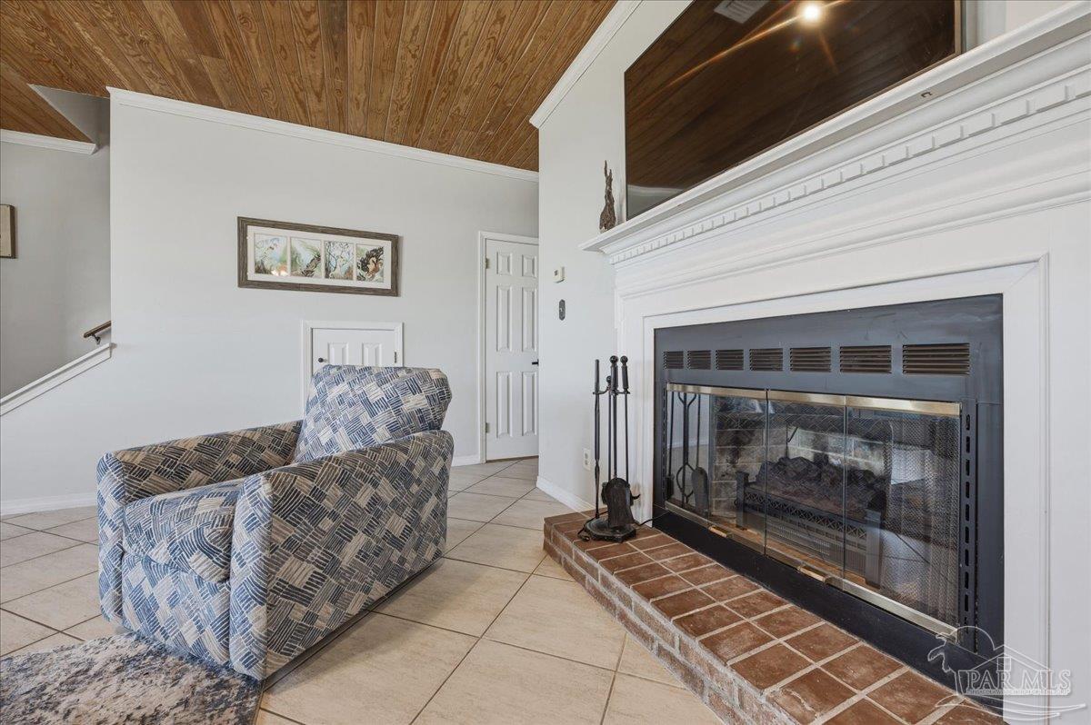 26063 Canal Road, Unit 3F Orange Beach, AL 36561 - Photo 21 of 72 a living room with furniture and a fireplace