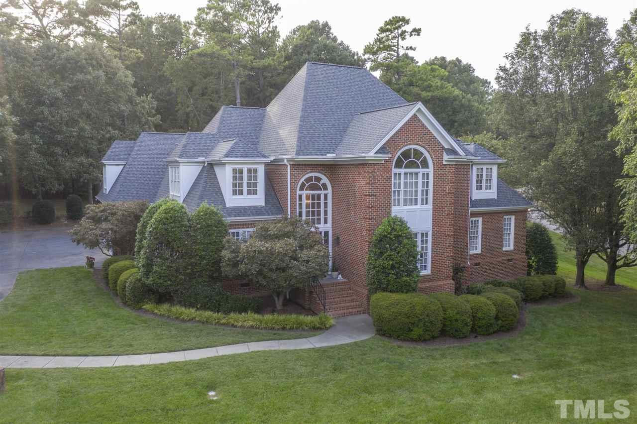 4621 White Chapel Way Raleigh, NC 27615 - Photo 2 of 30 a aerial view of a house next to a yard