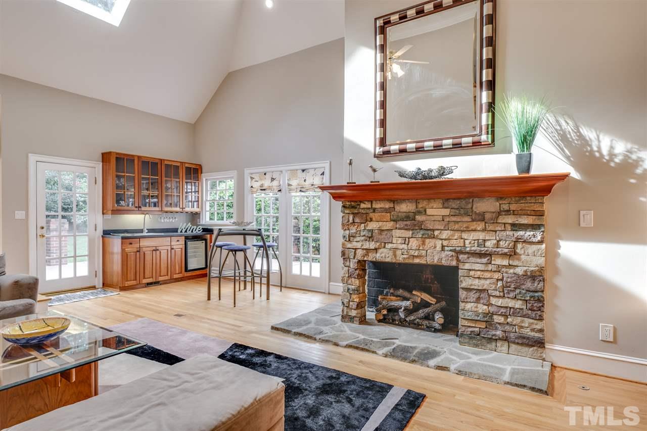 4621 White Chapel Way Raleigh, NC 27615 - Photo 13 of 30 a living room with furniture and a fireplace