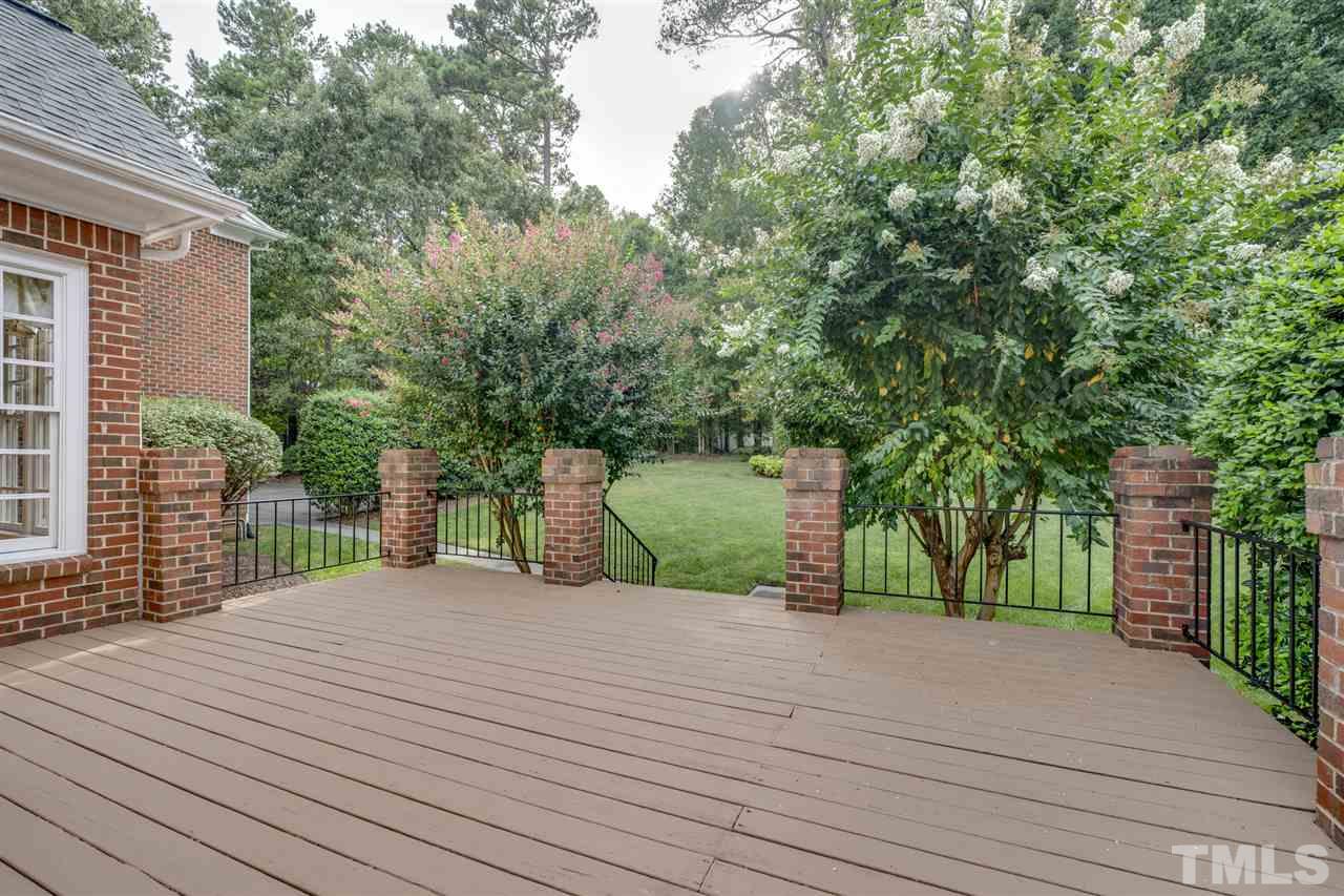 4621 White Chapel Way Raleigh, NC 27615 - Photo 25 of 30 a view of a house with a backyard