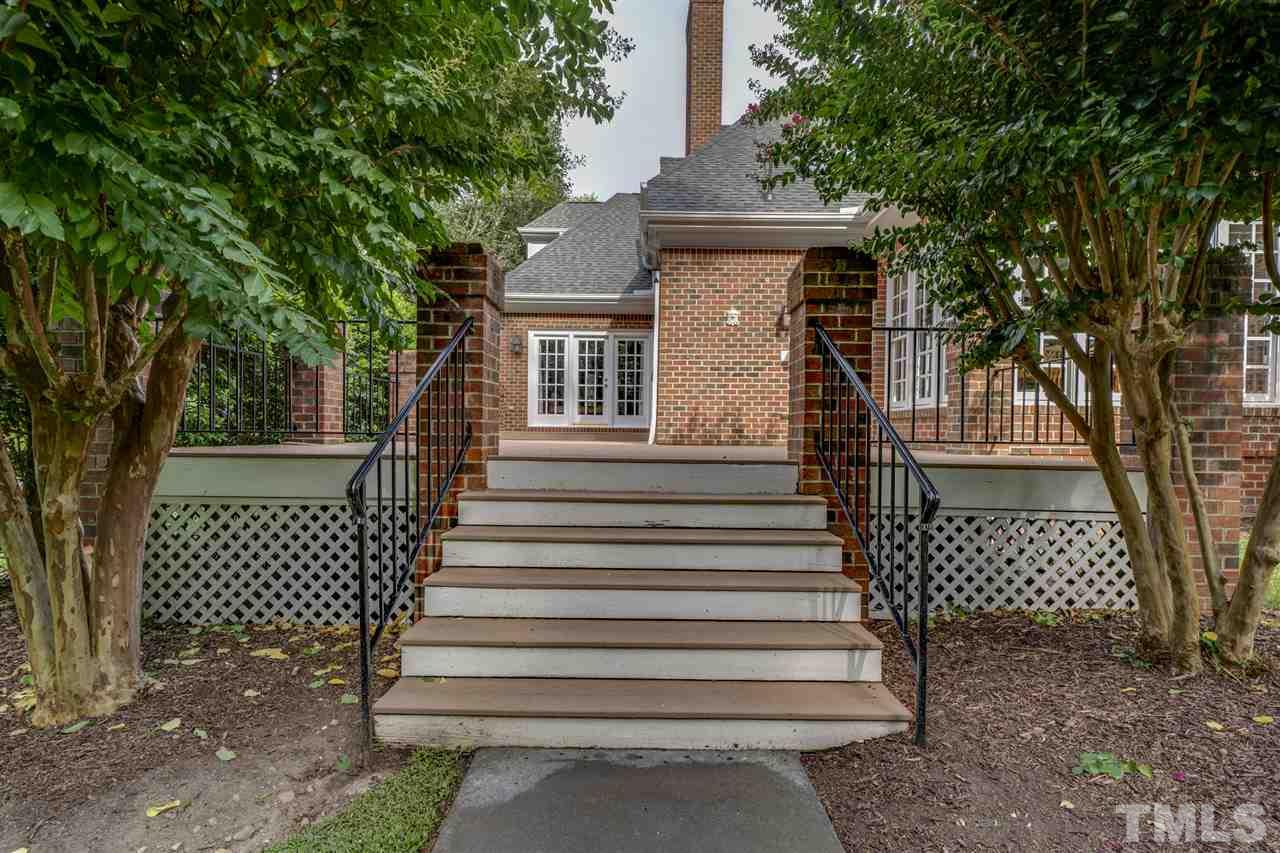 4621 White Chapel Way Raleigh, NC 27615 - Photo 26 of 30 a view of a house with a yard