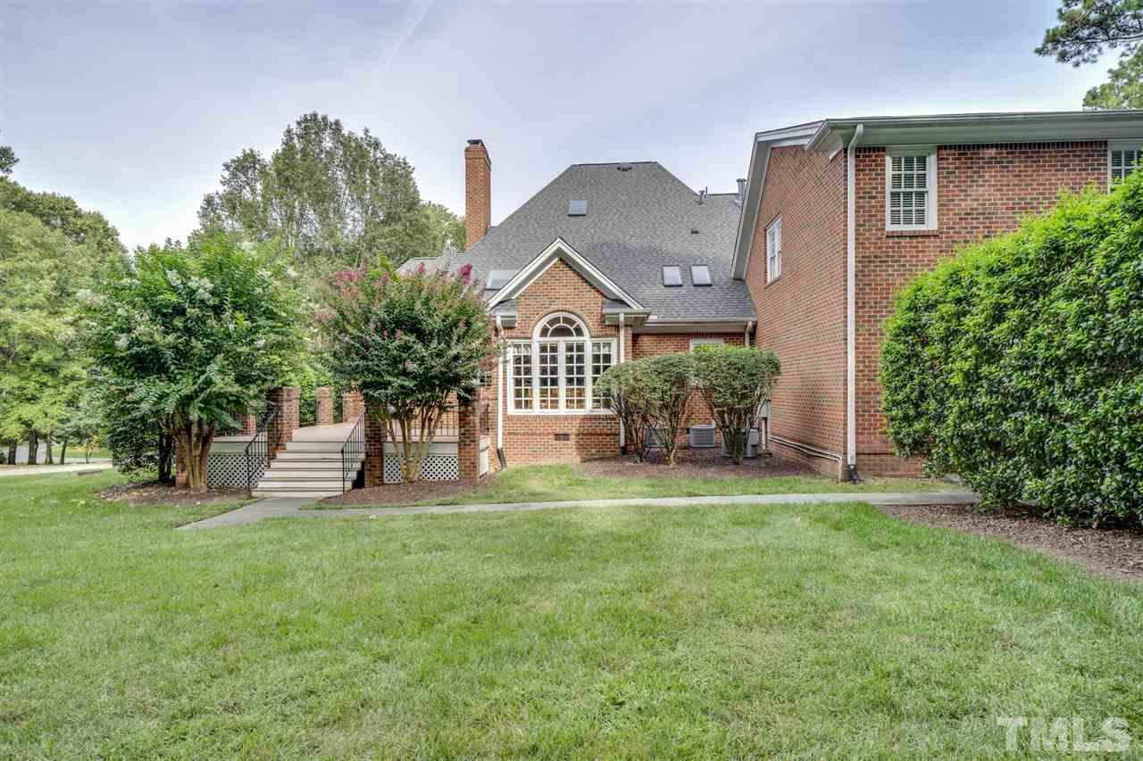 4621 White Chapel Way Raleigh, NC 27615 - Photo 27 of 30 a front view of a house with a garden and plants