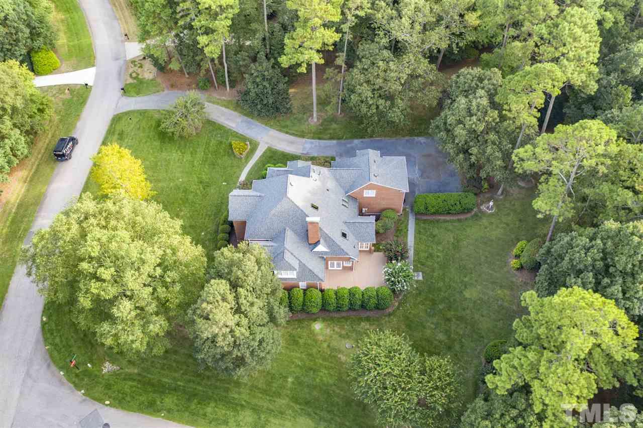 4621 White Chapel Way Raleigh, NC 27615 - Photo 30 of 30 an aerial view of a house with a garden and swimming pool