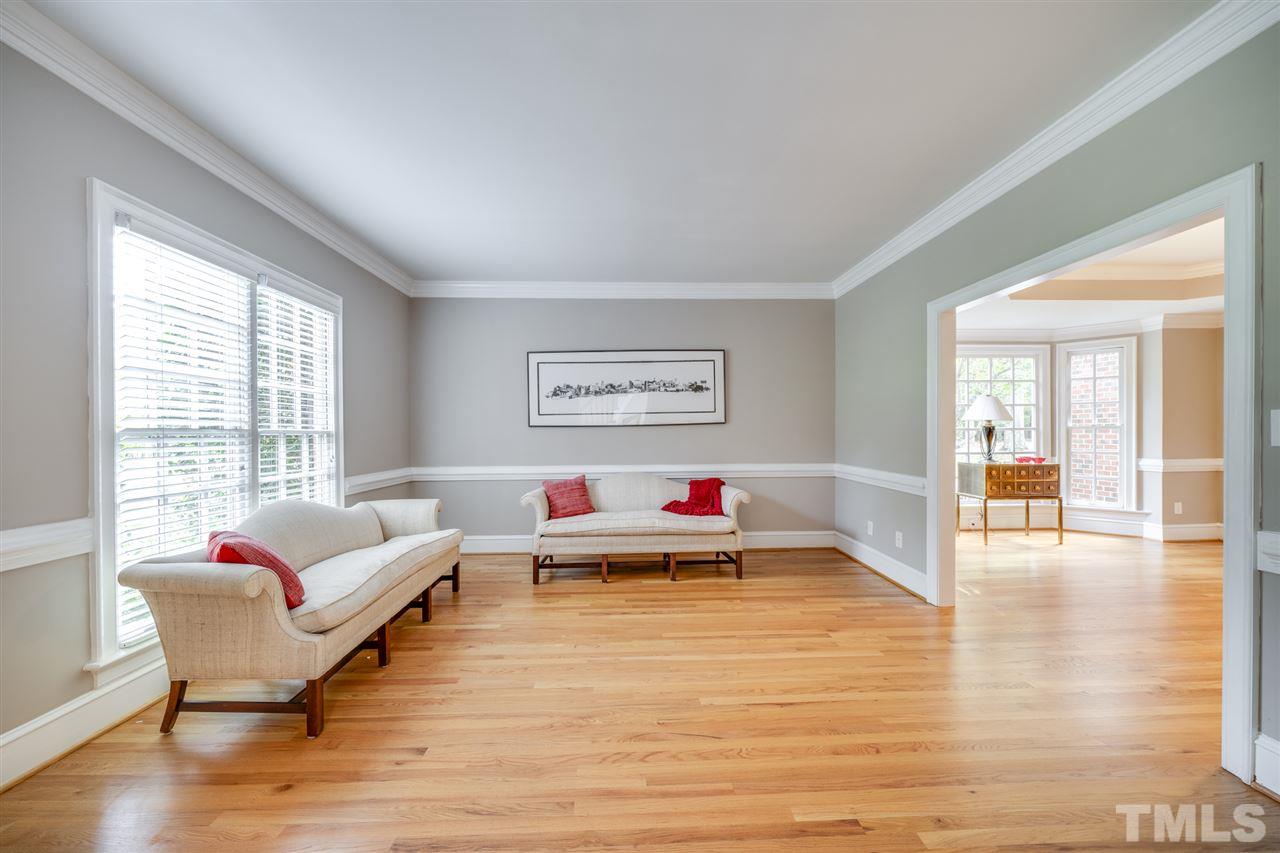 4621 White Chapel Way Raleigh, NC 27615 - Photo 5 of 30 a living room with furniture window and wooden floor