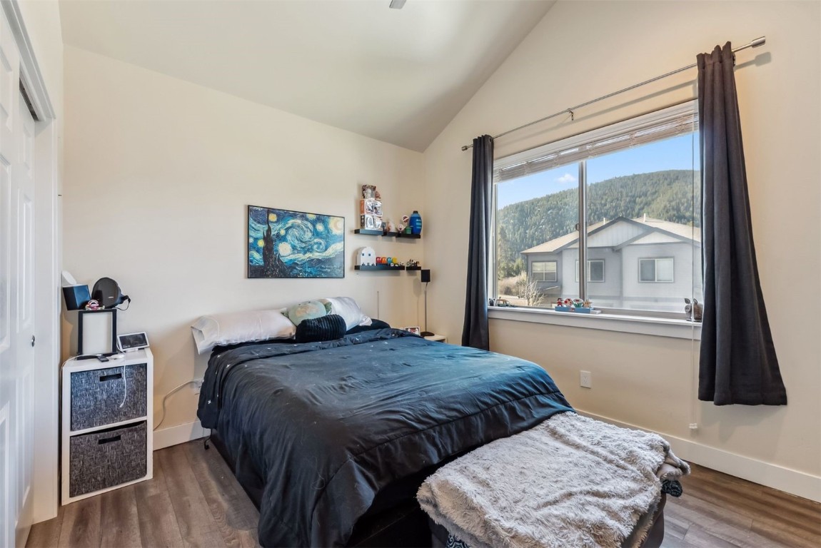 32 Wayback Drive, Unit 32 Keystone, CO 80435 - Photo 16 of 28 a bedroom with a bed and wooden floor
