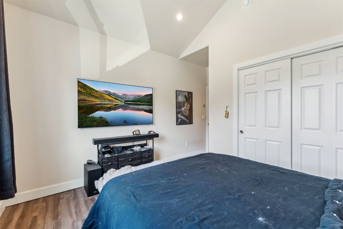 32 Wayback Drive, Unit 32 Keystone, CO 80435 - Photo 18 of 28 a bedroom with a bed and a flat screen tv