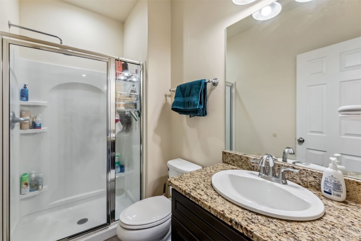 32 Wayback Drive, Unit 32 Keystone, CO 80435 - Photo 19 of 28 a bathroom with a granite countertop sink toilet and shower