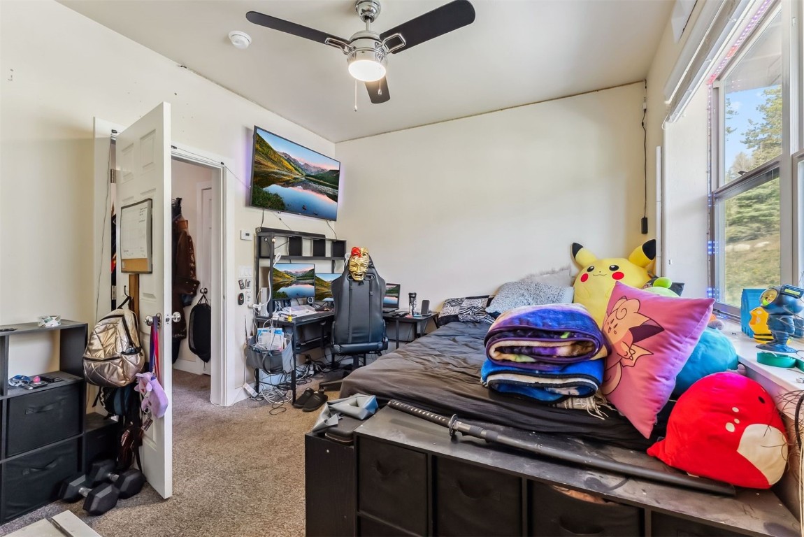 32 Wayback Drive, Unit 32 Keystone, CO 80435 - Photo 25 of 28 a bedroom with bed and a window