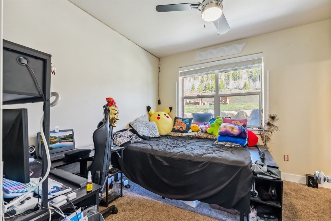 32 Wayback Drive, Unit 32 Keystone, CO 80435 - Photo 26 of 28 a bed room with furniture and a window