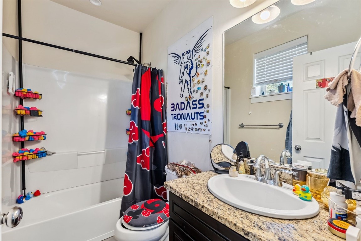 32 Wayback Drive, Unit 32 Keystone, CO 80435 - Photo 28 of 28 a bathroom with a granite countertop bathtub sink vanity mirror and toilet