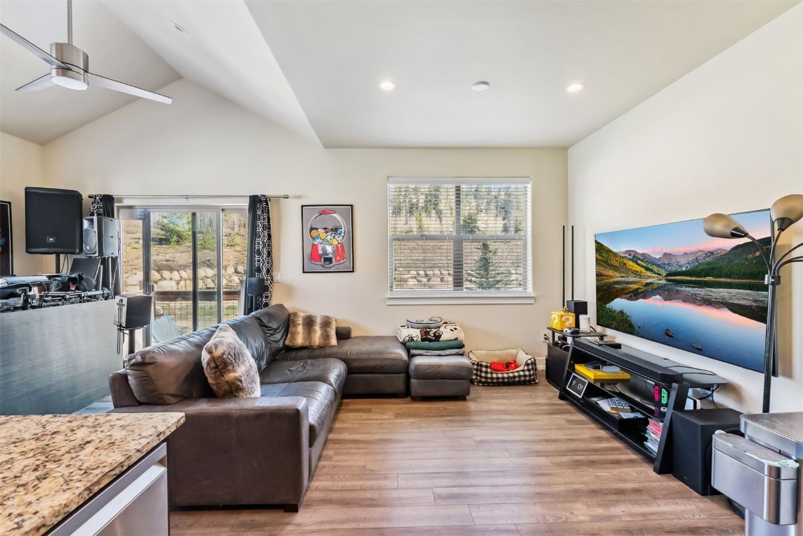32 Wayback Drive, Unit 32 Keystone, CO 80435 - Photo 5 of 28 a living room with furniture a rug and a flat screen tv