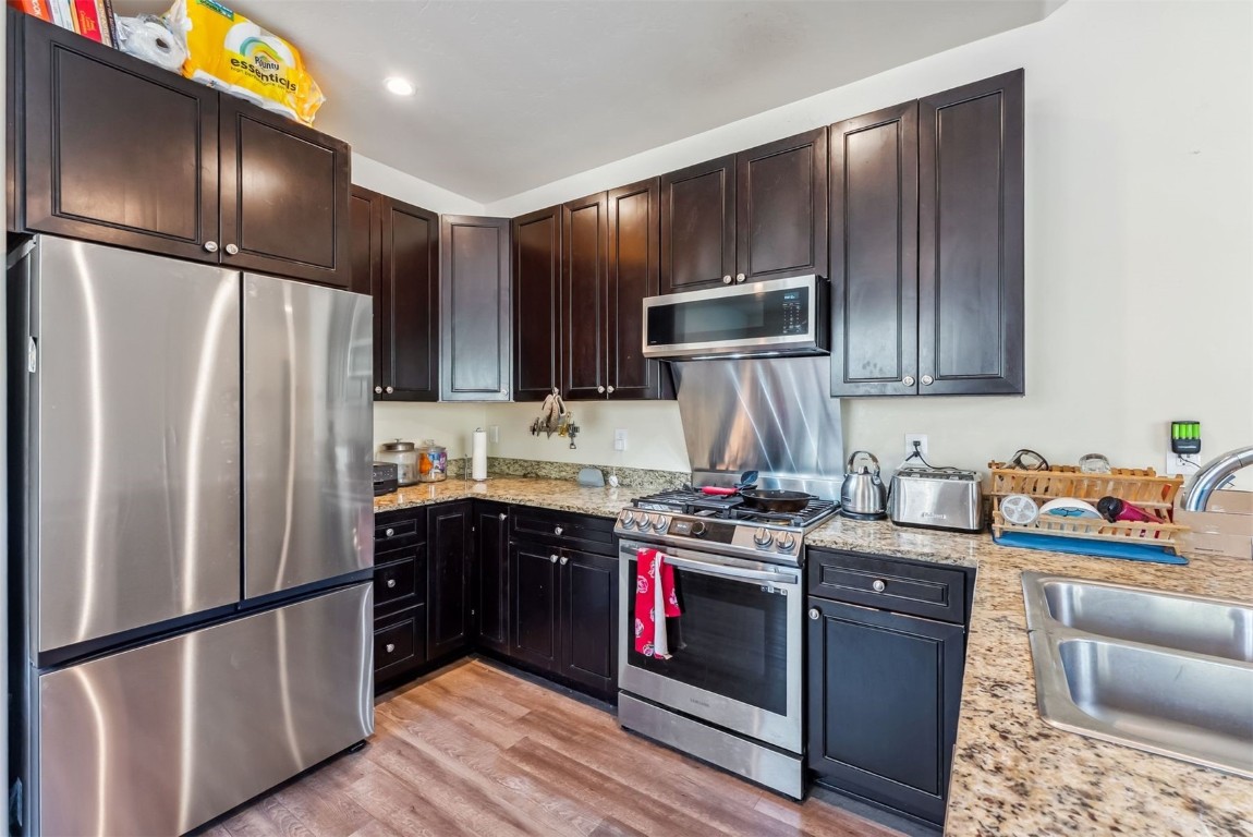 32 Wayback Drive, Unit 32 Keystone, CO 80435 - Photo 10 of 28 a kitchen with stainless steel appliances granite countertop a refrigerator stove and sink