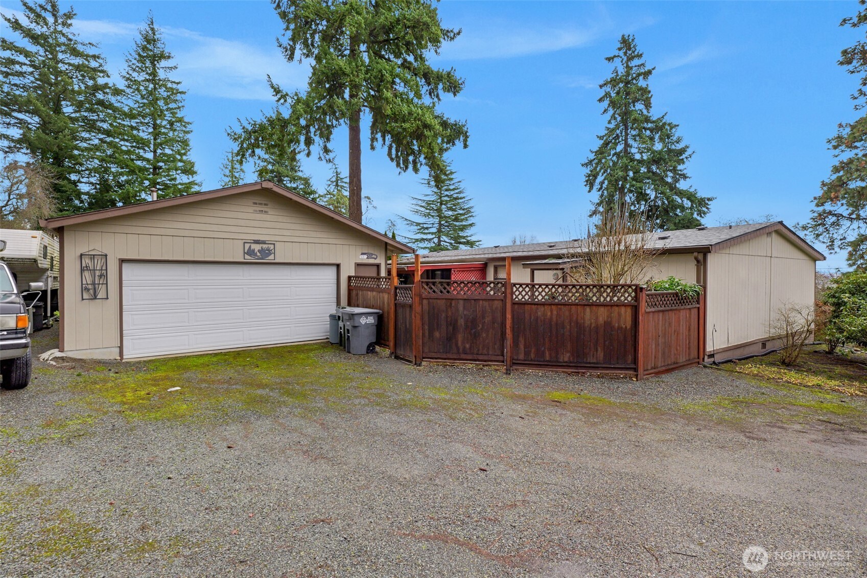 6217 4th Street East Tacoma, WA 98424 - Photo 1 of 40 a view of a house with a yard and garage