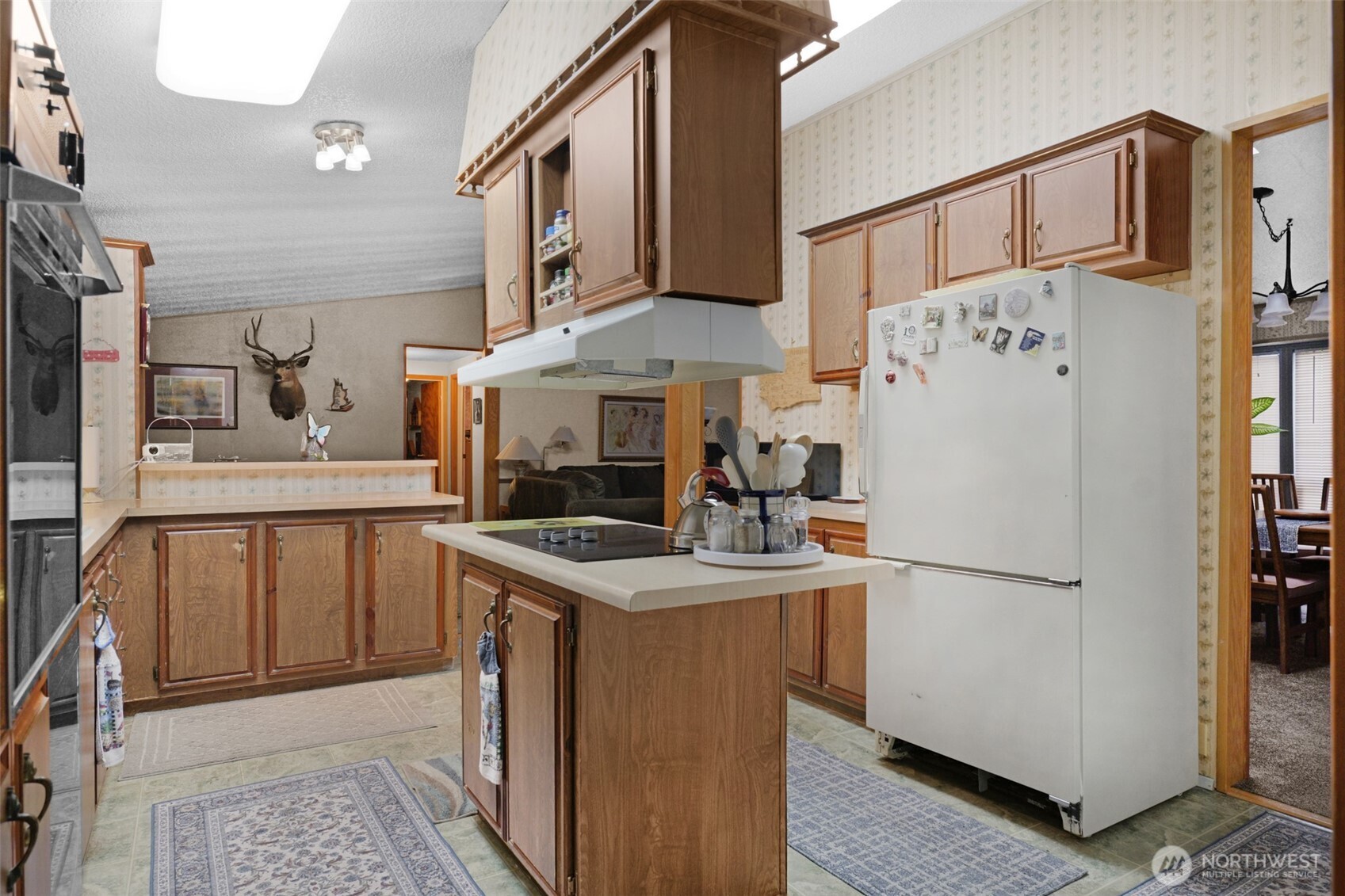 6217 4th Street East Tacoma, WA 98424 - Photo 11 of 40 a kitchen with stainless steel appliances granite countertop a refrigerator a stove and a sink