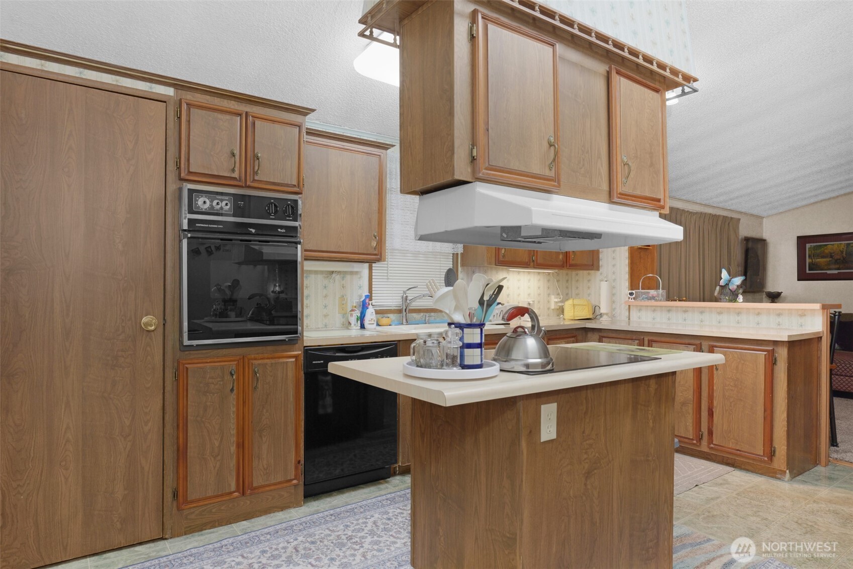 6217 4th Street East Tacoma, WA 98424 - Photo 12 of 40 a kitchen with stainless steel appliances granite countertop a sink stove and refrigerator
