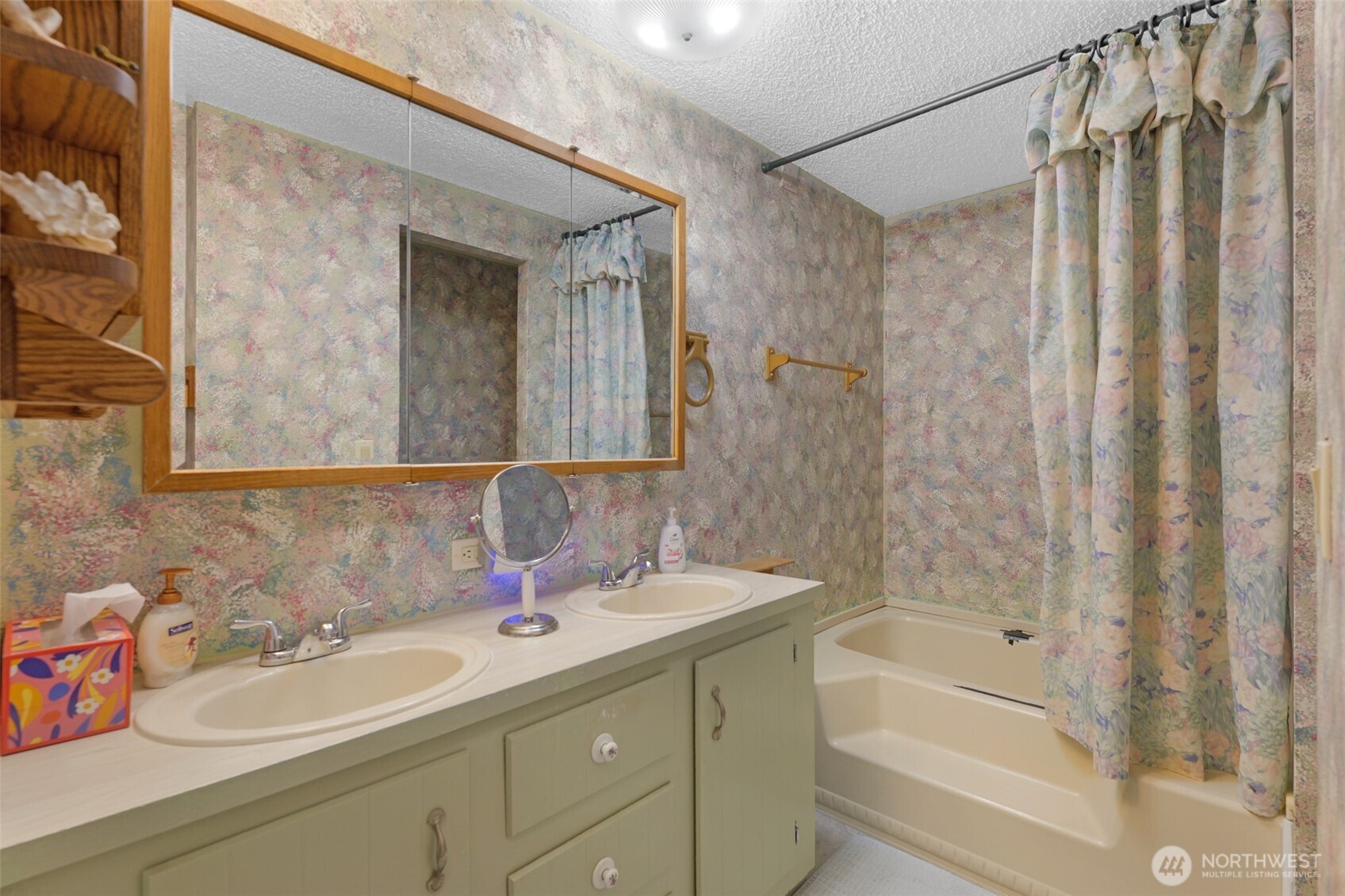 6217 4th Street East Tacoma, WA 98424 - Photo 18 of 40 a bathroom with a sink double vanity mirror and a bathtub