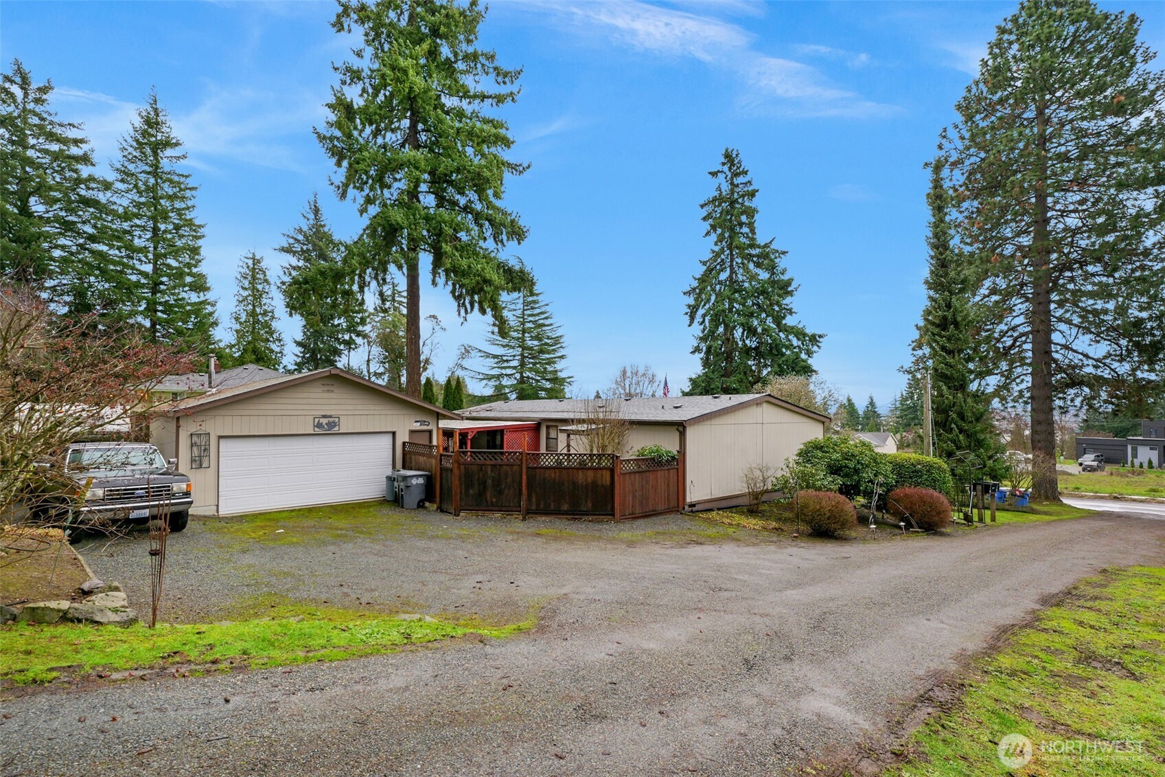 6217 4th Street East Tacoma, WA 98424 - Photo 2 of 40 a front view of a house with a garden and tree