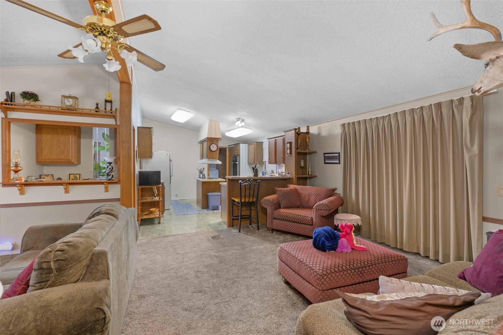 6217 4th Street East Tacoma, WA 98424 - Photo 24 of 40 a living room with furniture and a flat screen tv