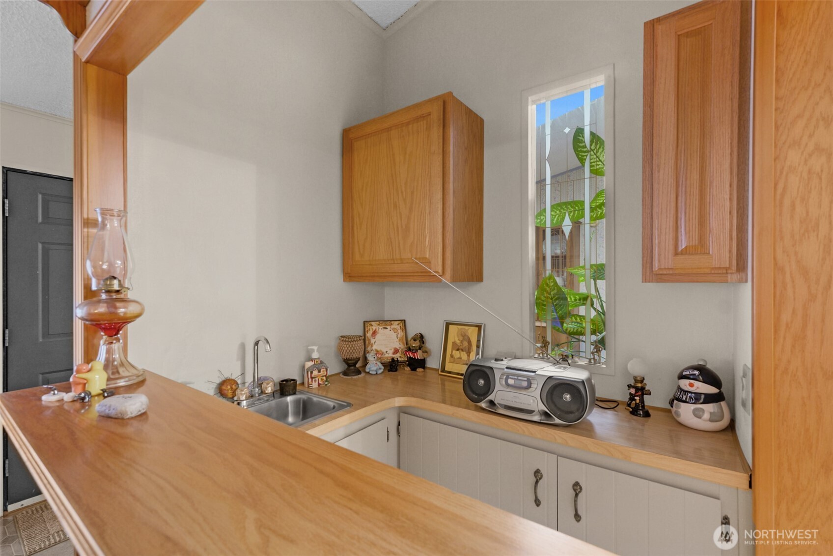 6217 4th Street East Tacoma, WA 98424 - Photo 26 of 40 a kitchen with a sink and a cabinets
