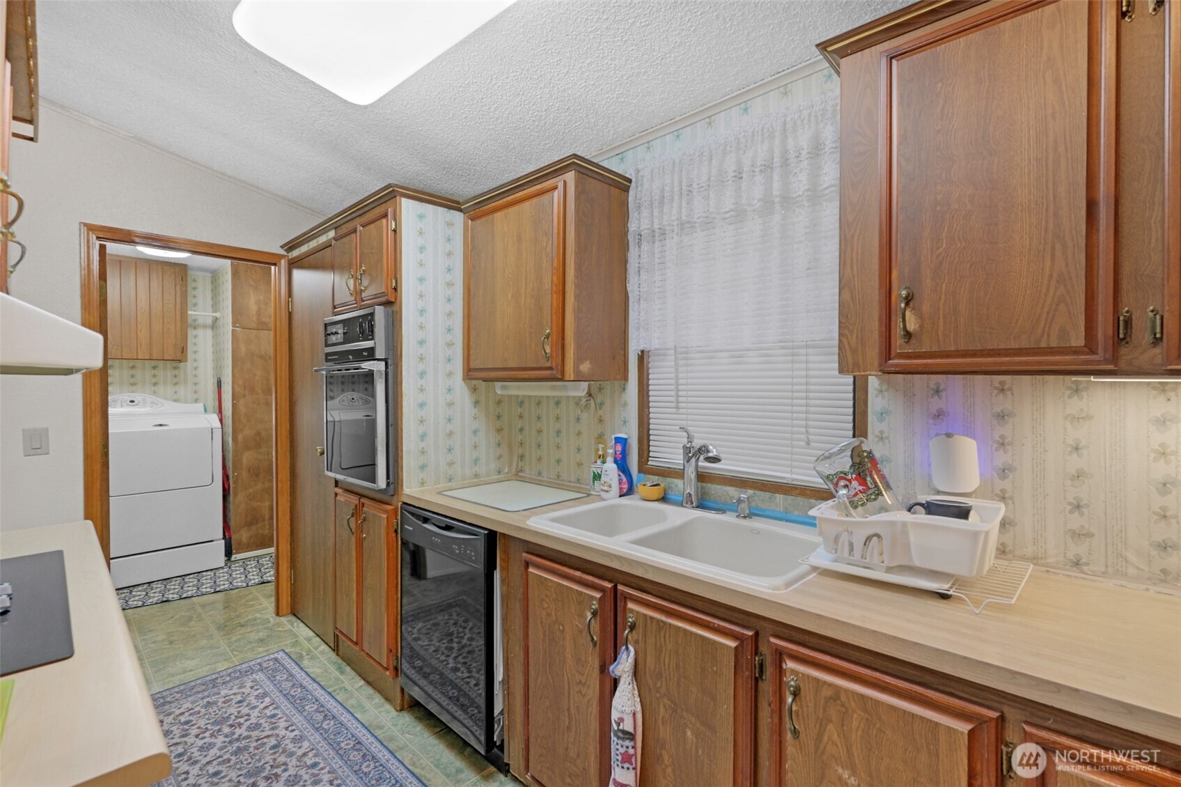 6217 4th Street East Tacoma, WA 98424 - Photo 29 of 40 a bathroom with a sink and a mirror