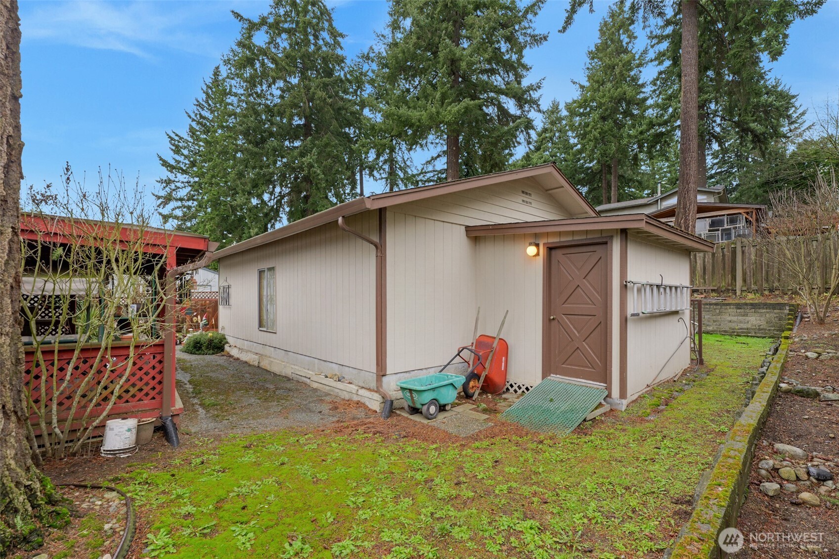 6217 4th Street East Tacoma, WA 98424 - Photo 7 of 40 a view of a backyard with small cabin