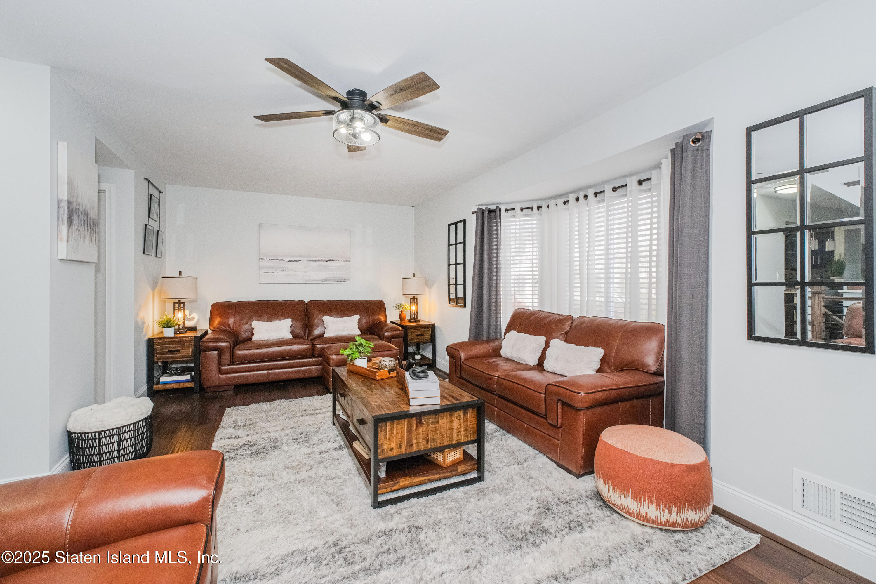 217 Jamie Lane Staten Island, NY 10312 - Photo 12 of 29 a living room with furniture and a large window