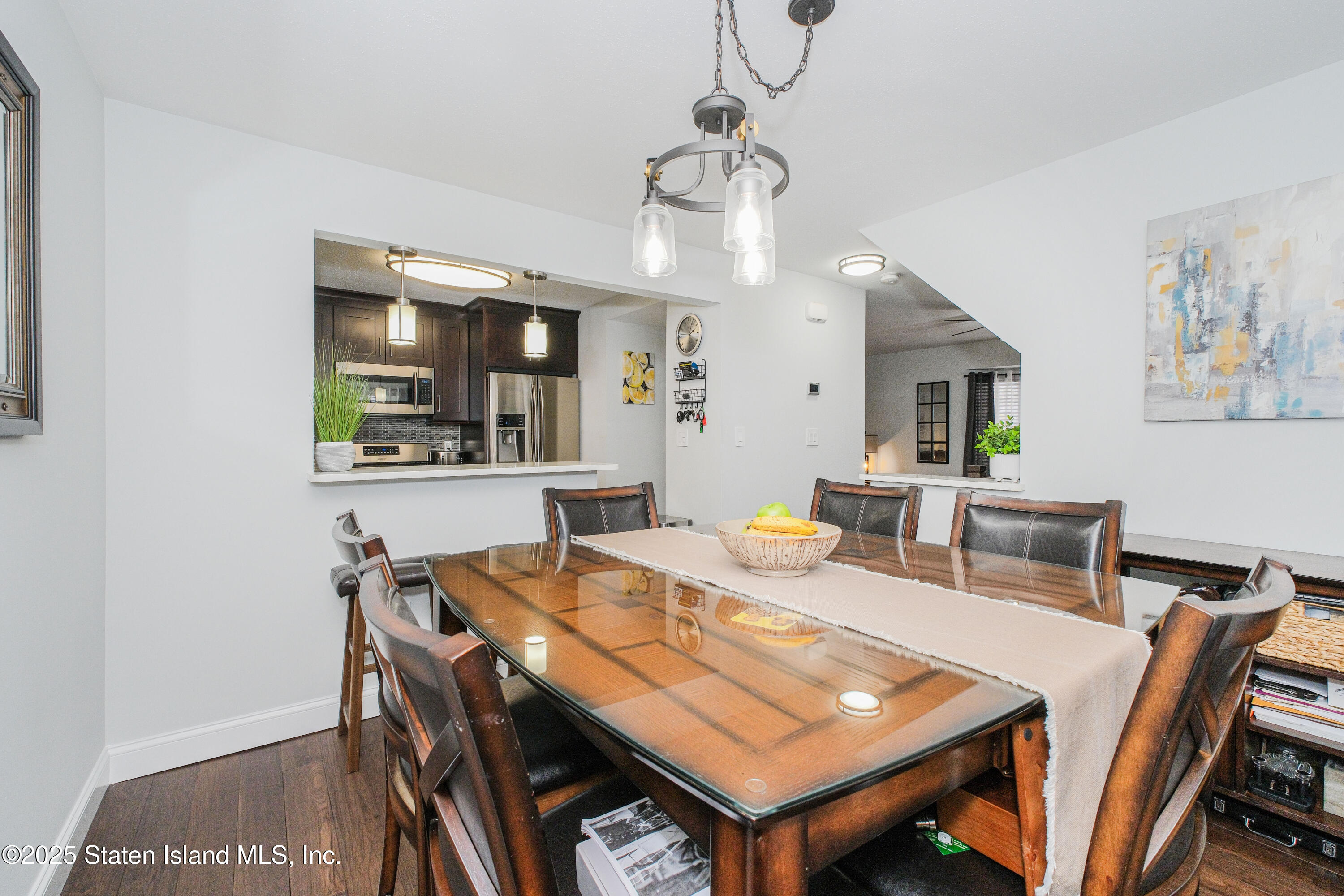 217 Jamie Lane Staten Island, NY 10312 - Photo 18 of 29 a view of a dining room with furniture and wooden floor