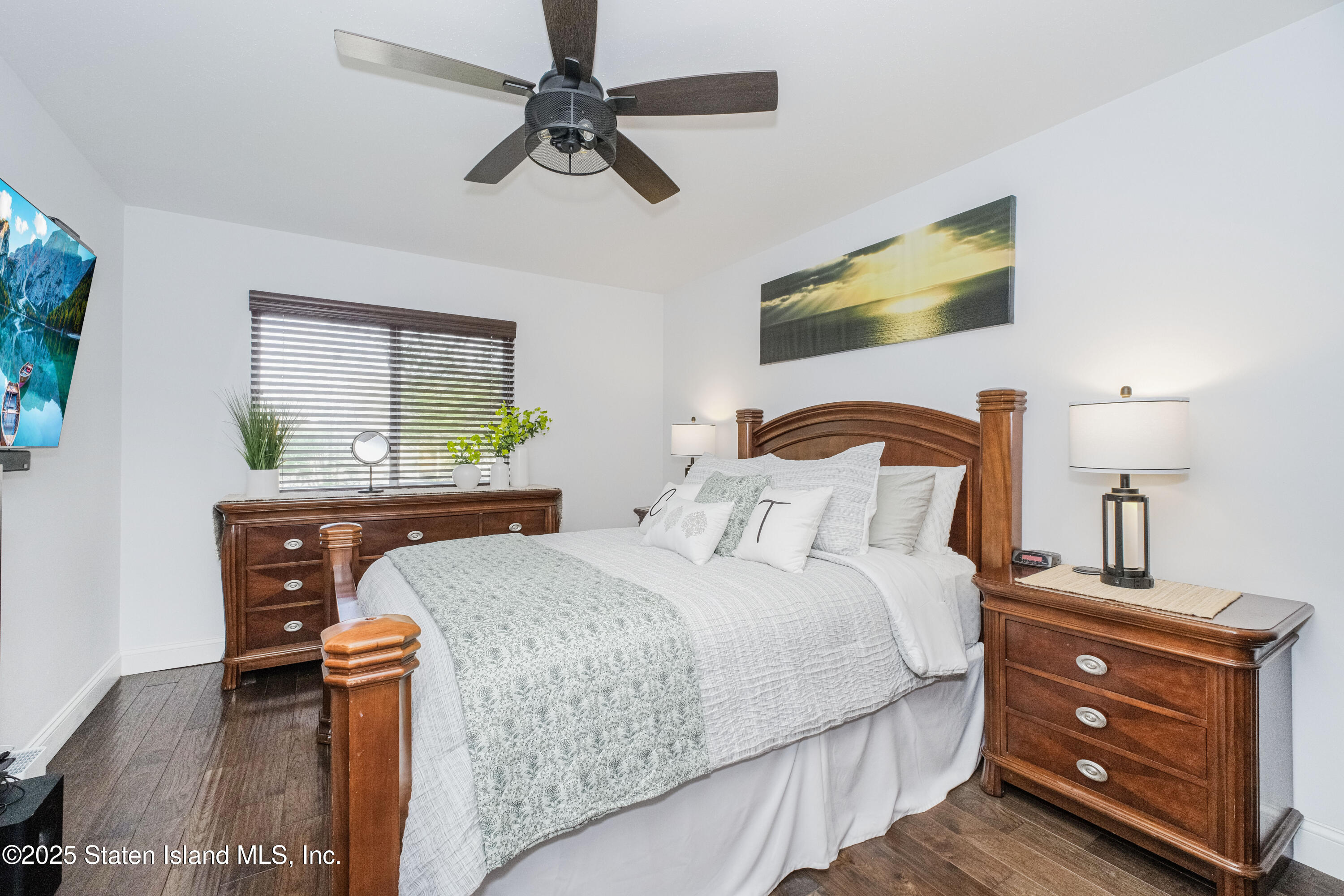 217 Jamie Lane Staten Island, NY 10312 - Photo 20 of 29 a bedroom with a bed and a dresser