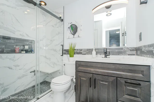 a bedroom with a bed and furniture