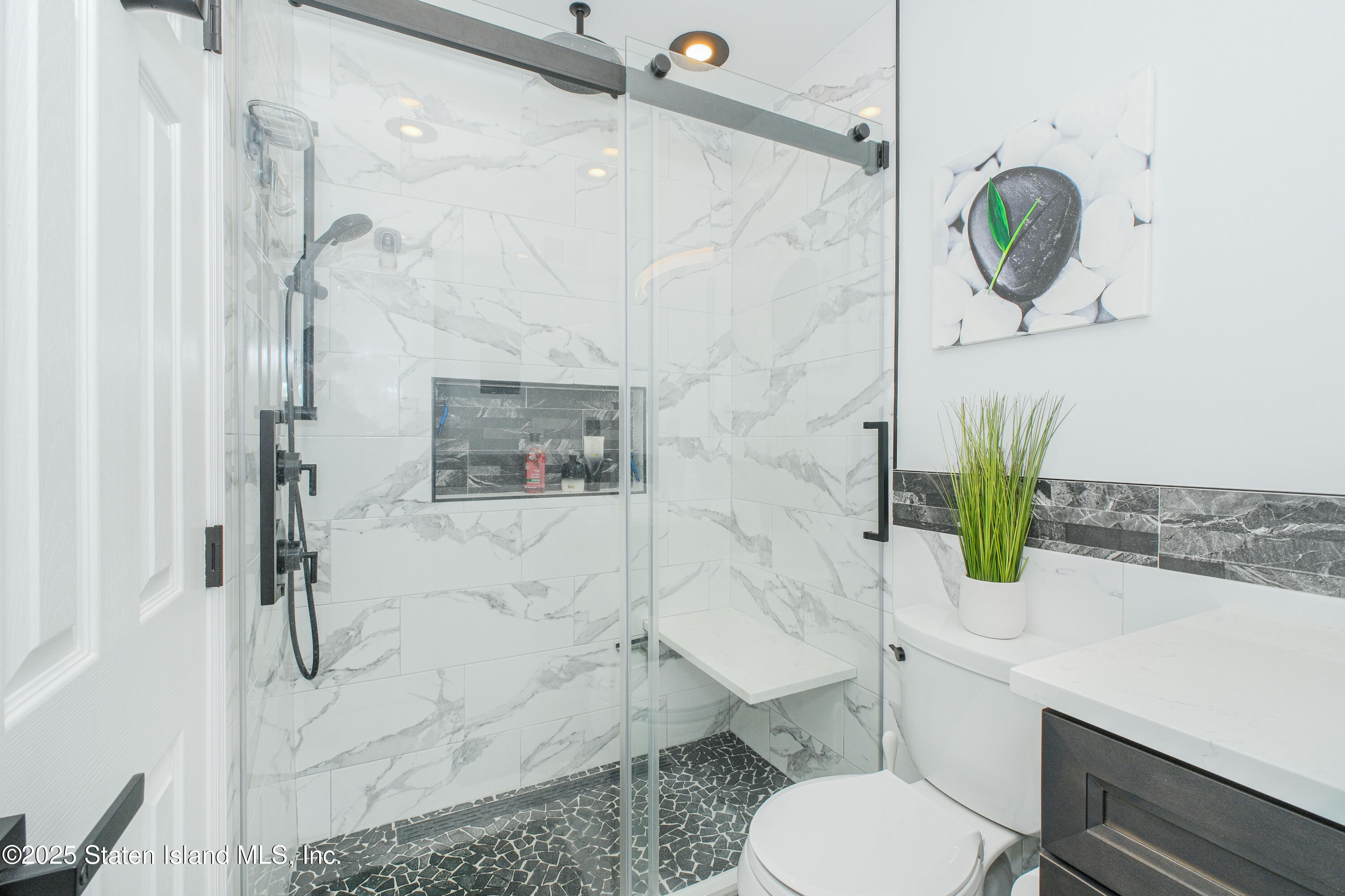 217 Jamie Lane Staten Island, NY 10312 - Photo 23 of 29 a bathroom with a toilet sink and shower