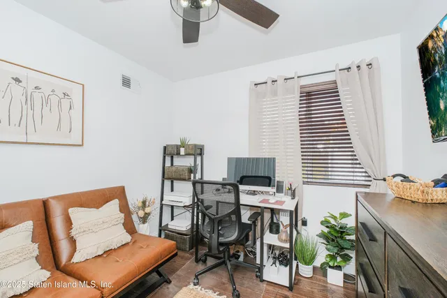 a room with furniture and a flat screen tv