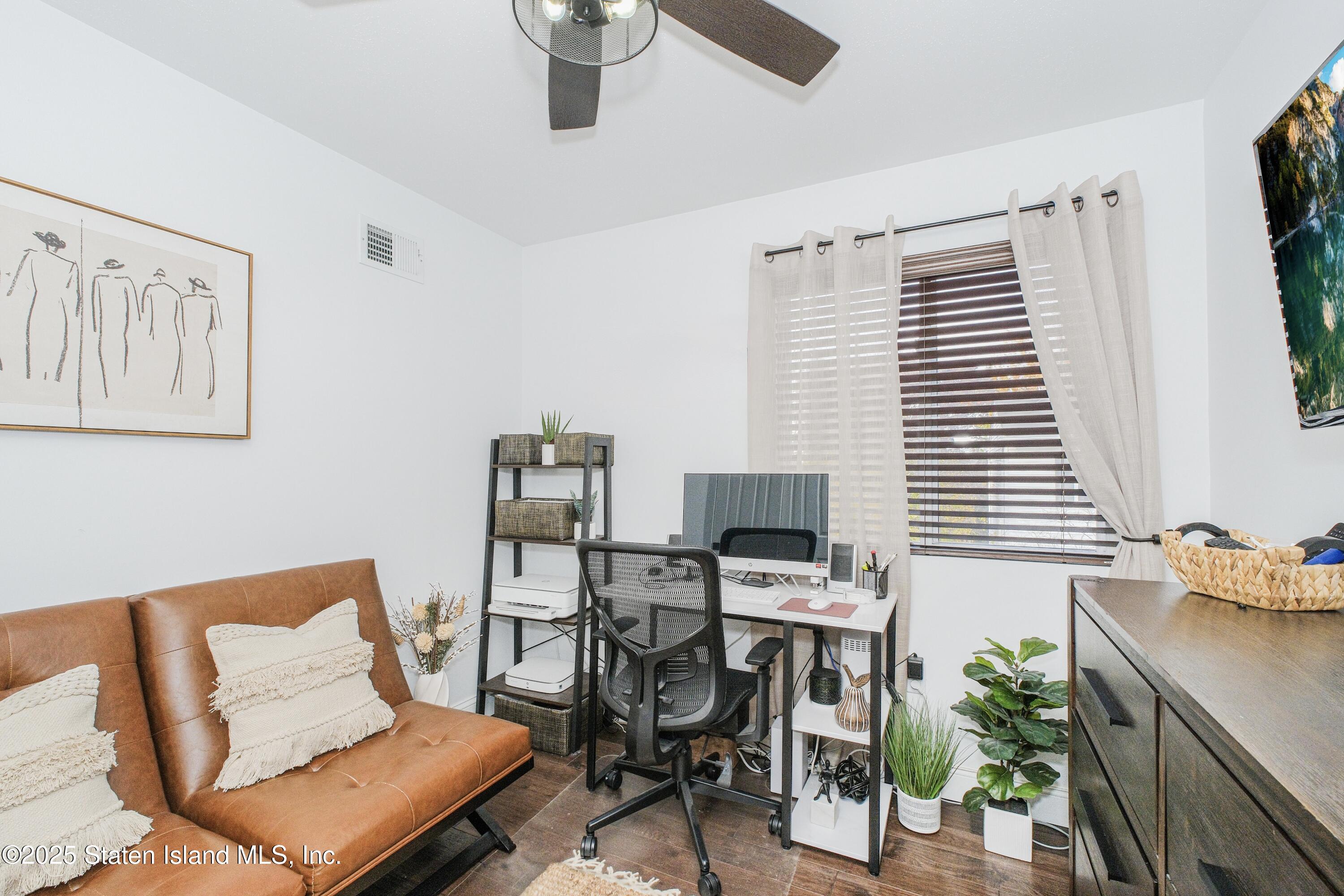 217 Jamie Lane Staten Island, NY 10312 - Photo 24 of 29 a work room with furniture and a potted plant