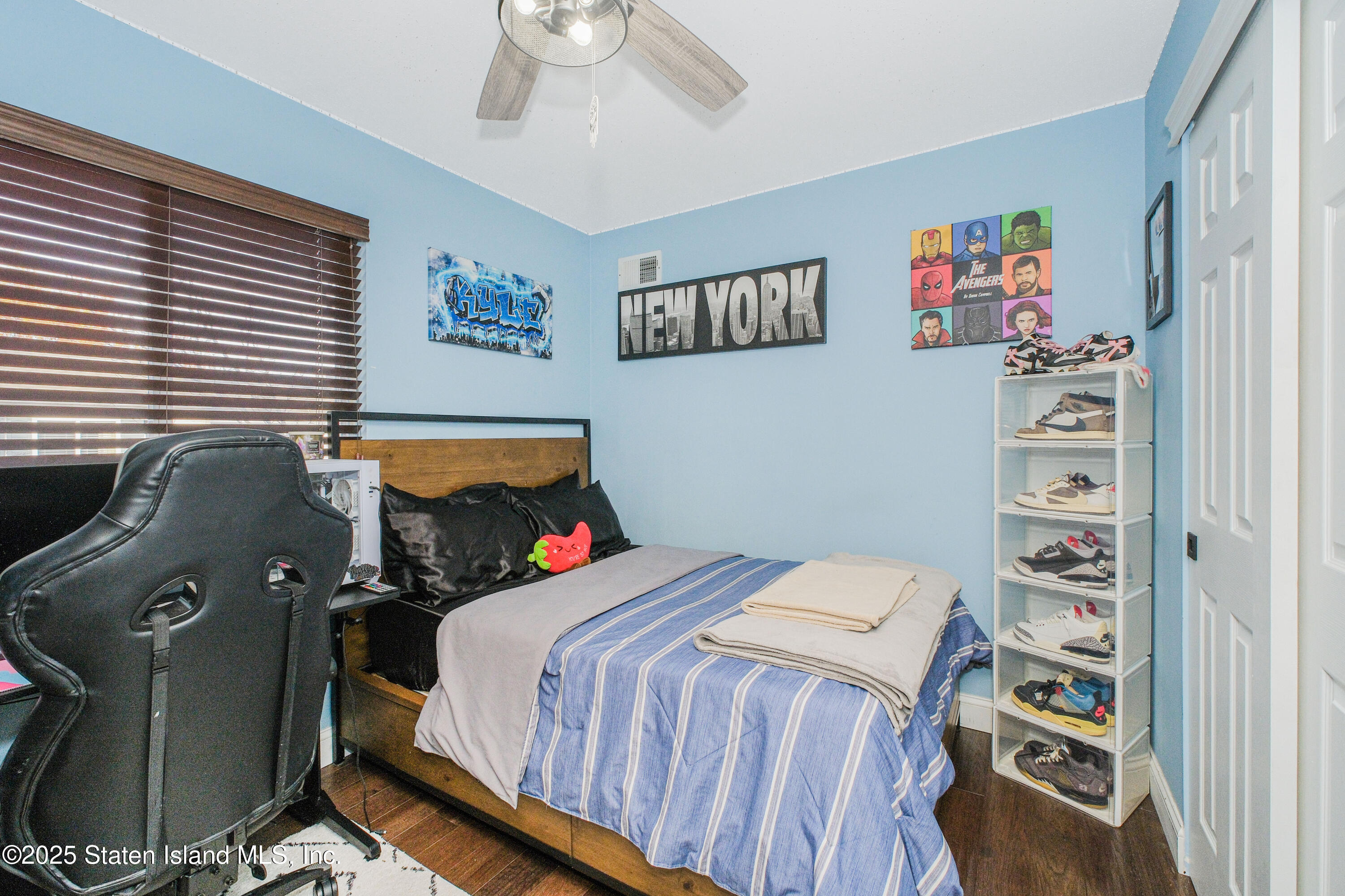 217 Jamie Lane Staten Island, NY 10312 - Photo 26 of 29 a bedroom with a bed and furniture