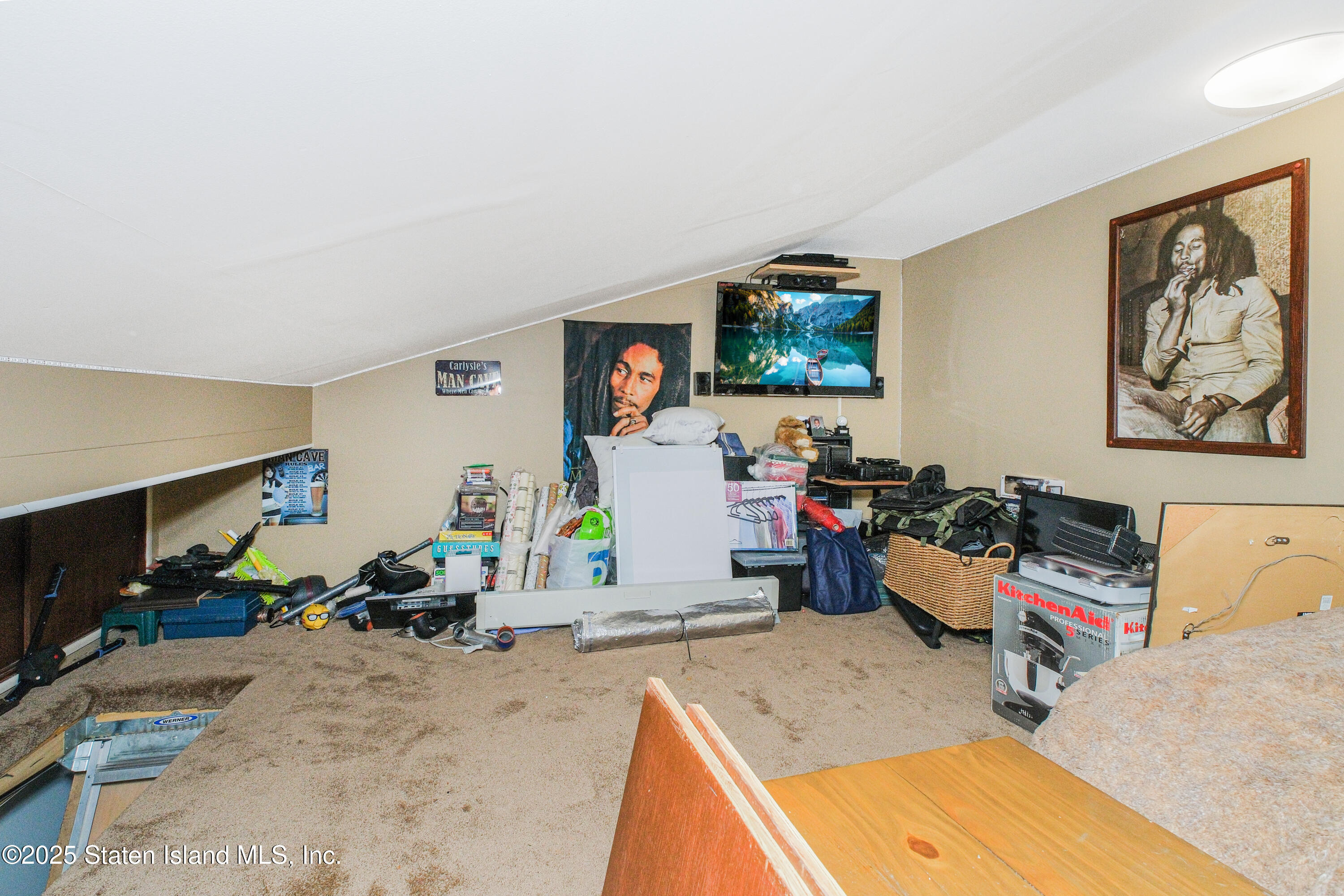 217 Jamie Lane Staten Island, NY 10312 - Photo 29 of 29 a room with furniture and a flat screen tv