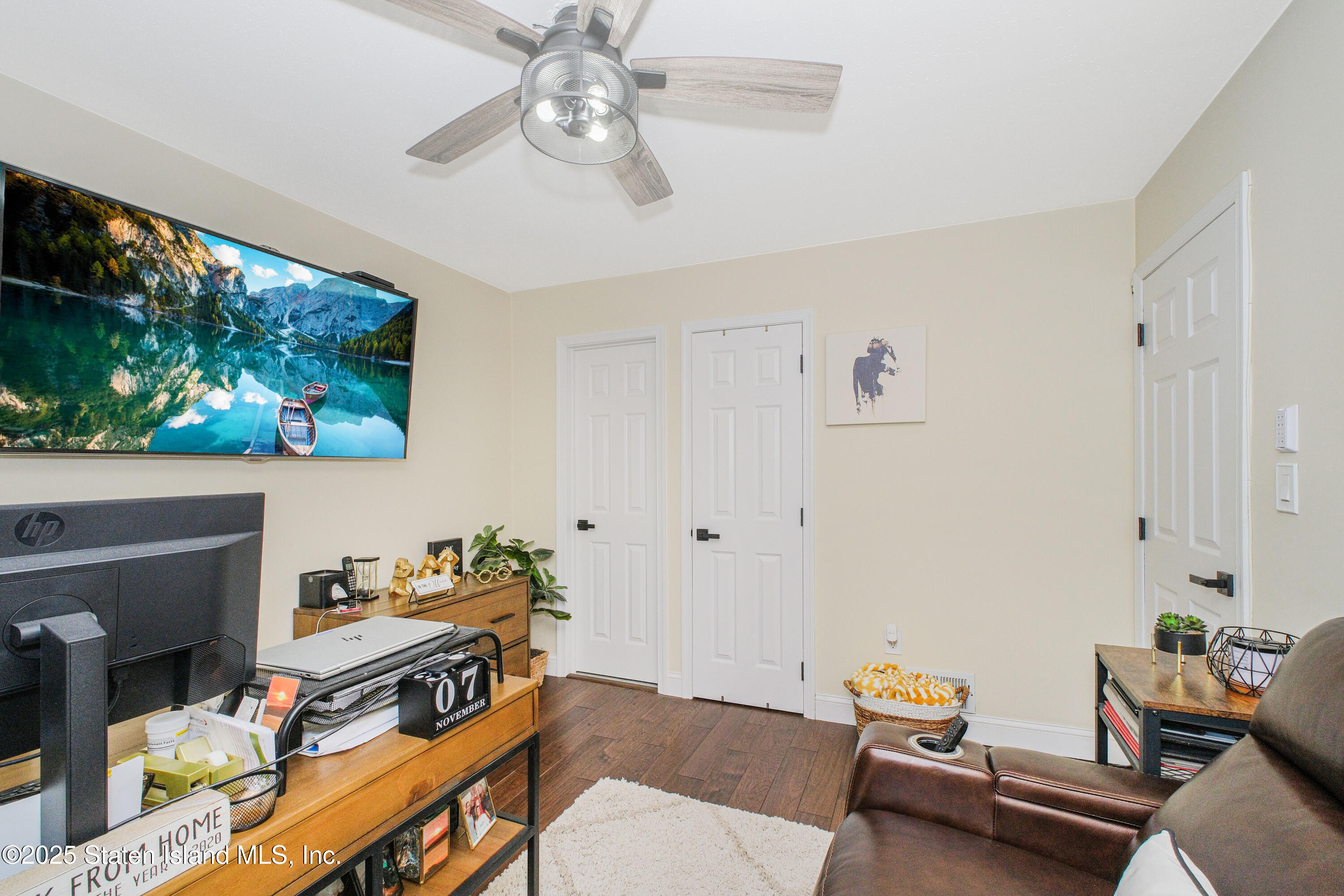 217 Jamie Lane Staten Island, NY 10312 - Photo 6 of 29 a living room with furniture and a fireplace