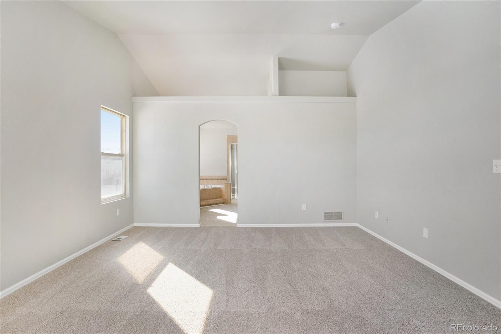 11949 Rio Secco Road Peyton, CO 80831 - Photo 11 of 19 an empty room with windows