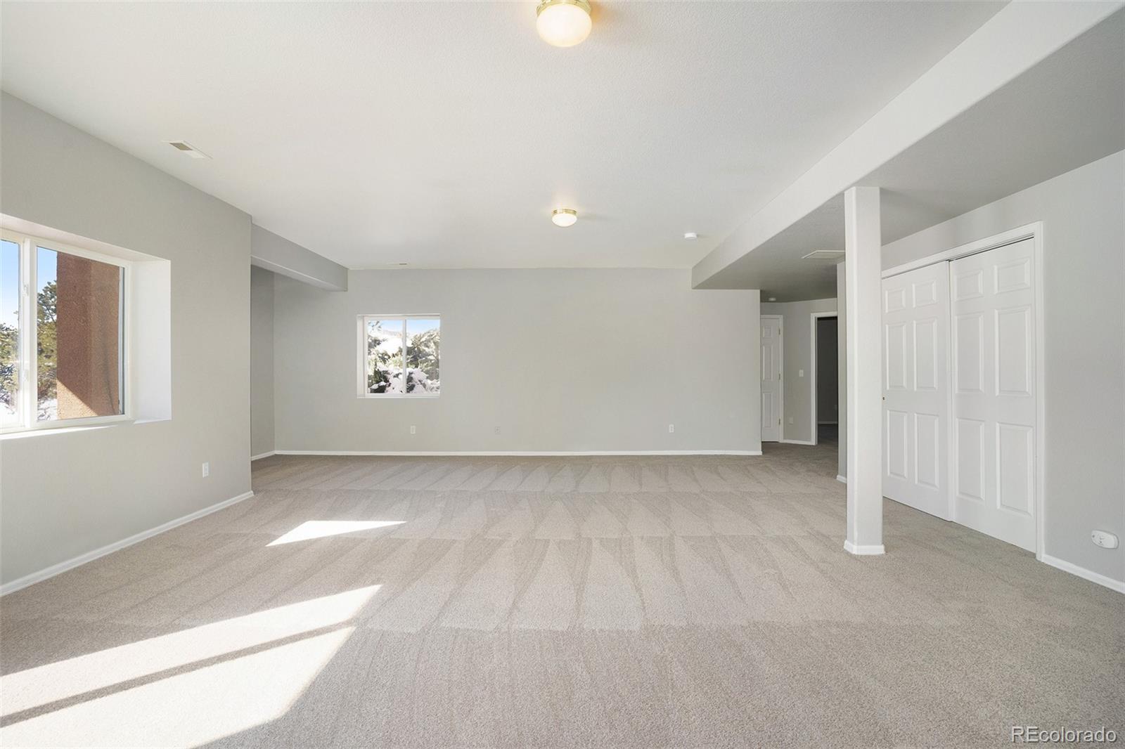 11949 Rio Secco Road Peyton, CO 80831 - Photo 15 of 19 a view of an empty room with window and cabinet