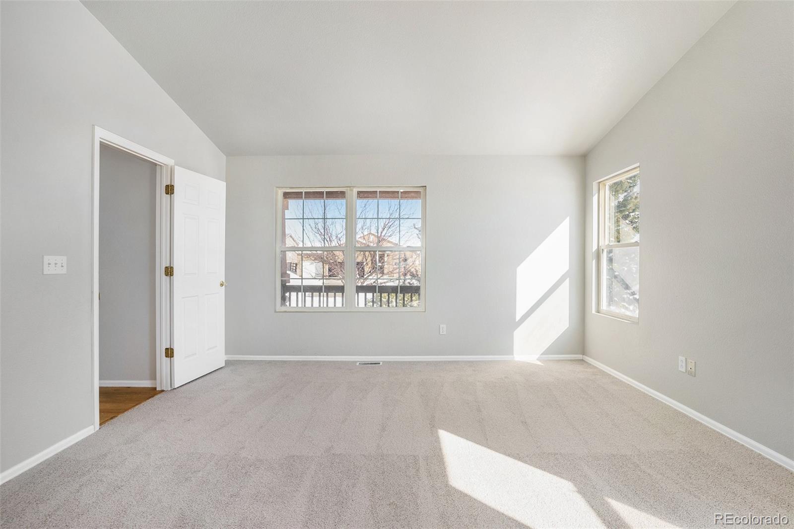 11949 Rio Secco Road Peyton, CO 80831 - Photo 17 of 19 an empty room with windows