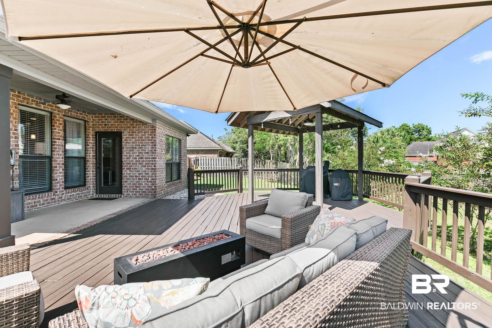 9522 Sanibel Loop Daphne, AL 36526 - Photo 33 of 43 Deck with an outdoor living space with a fire pit, area for grilling, a ceiling fan, and a gazebo