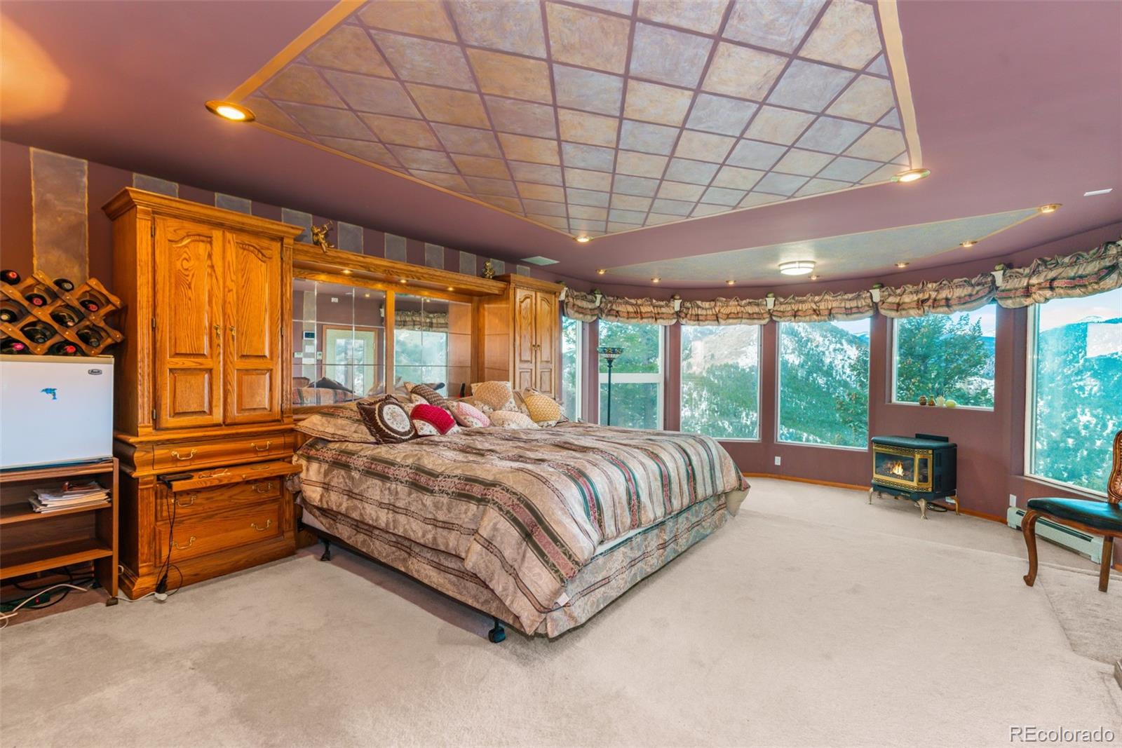 323 Overlook Lane Boulder, CO 80302 - Photo 29 of 40 a bed room with a bed and large windows