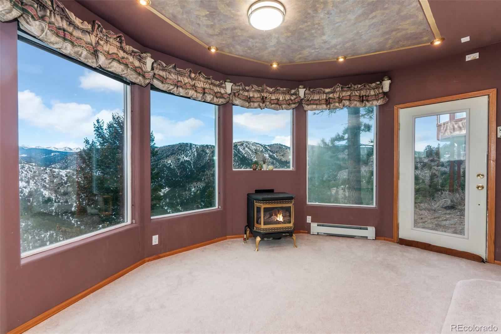 323 Overlook Lane Boulder, CO 80302 - Photo 30 of 40 a view of a room with a large window and table in it
