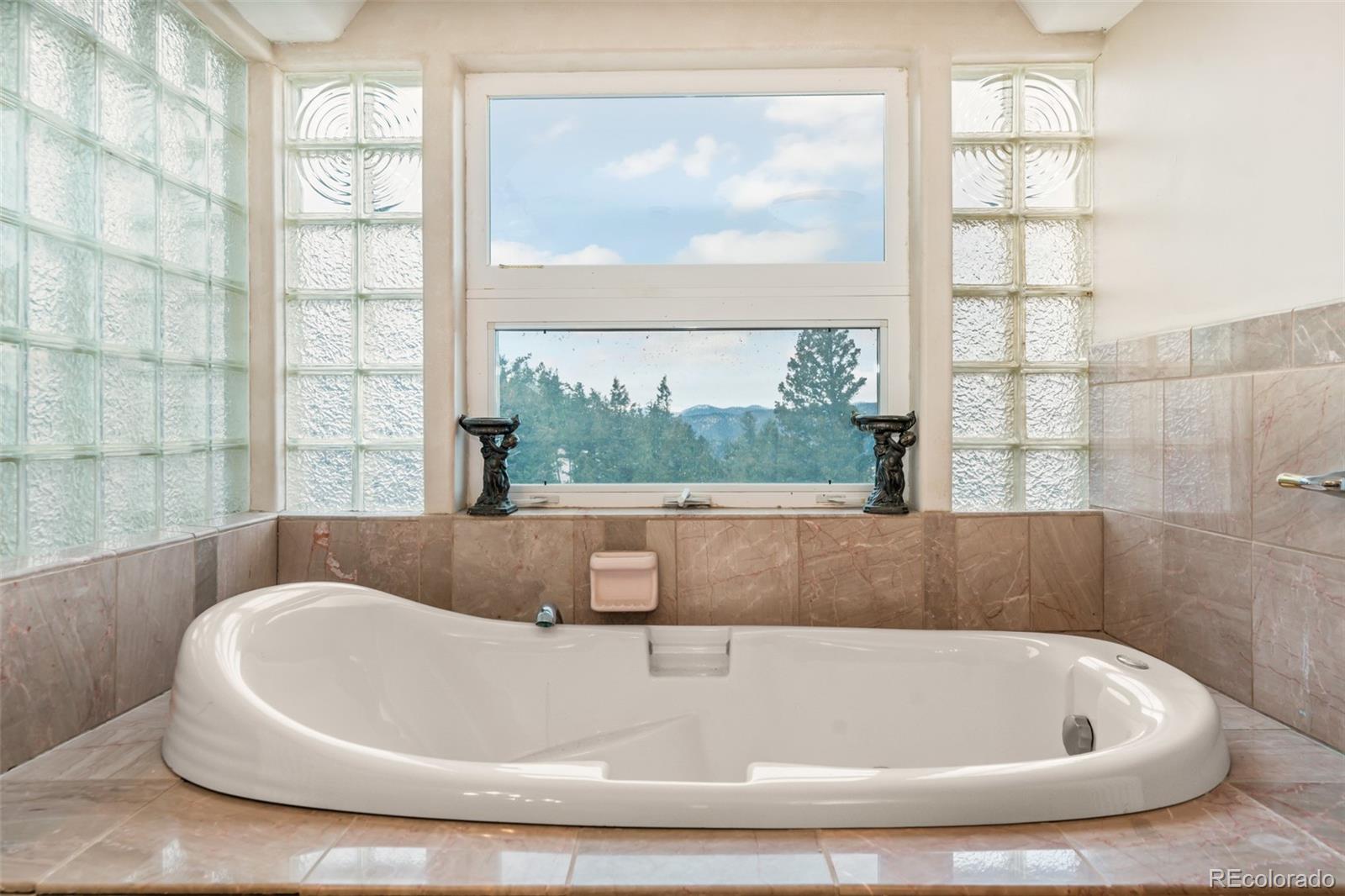 323 Overlook Lane Boulder, CO 80302 - Photo 32 of 40 a bath tub sitting next to a window