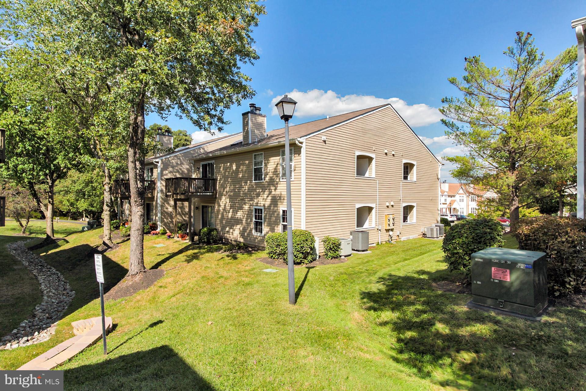 7712 D Lexton Place, Unit 92 Springfield, VA 22152 - Photo 18 of 35 Back of the property with luscious green space!