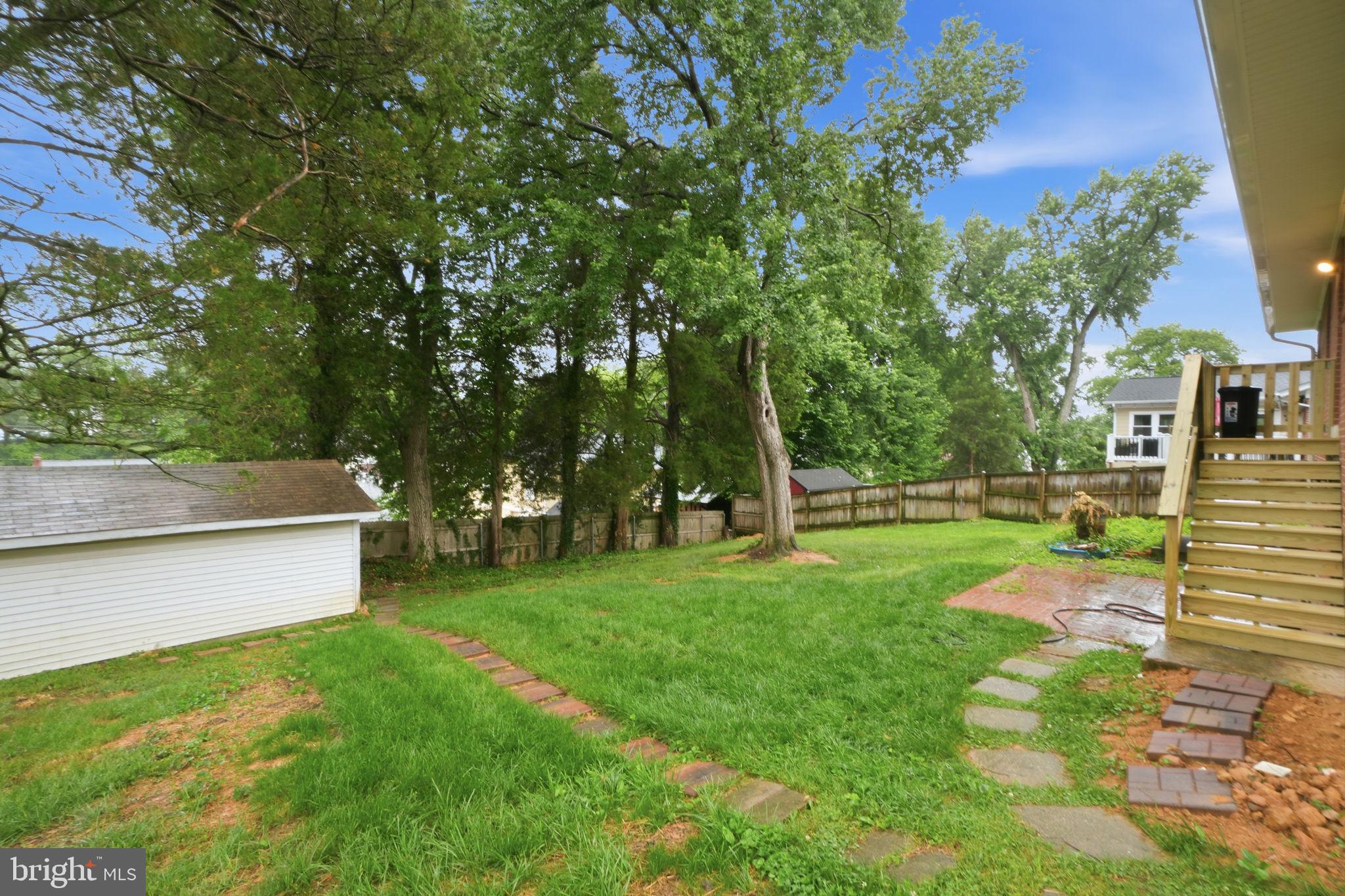 5304 Pillow Lane Springfield, VA 22151 - Photo 30 of 32 a view of a backyard with large trees